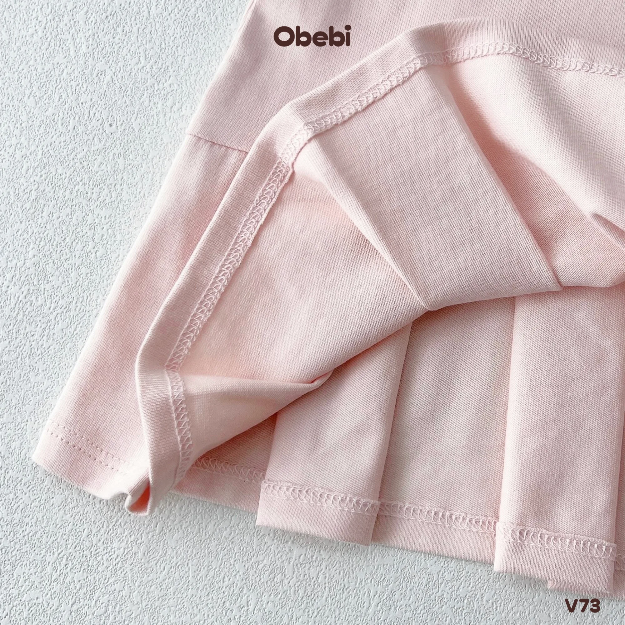 V73 – Váy Ba Lỗ Bé Gái Mùa Hè Xếp Ly Lệch Obebi
