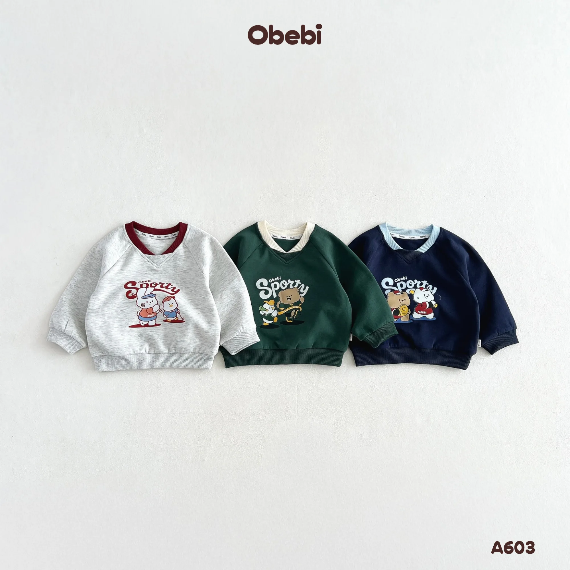 A603 – Áo Dài Tay Raglan Trẻ Em Thu Đông Cổ Tim Hình In Nhân Vật Thương Hiệu Obebi